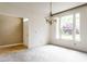 Bright living room with large windows, providing plenty of natural light and a view of the outside at 7131 Topp Creek Ct, Indianapolis, IN 46214