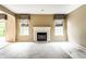 Spacious living room featuring a fireplace, windows, and neutral paint, ready for personalization at 7131 Topp Creek Ct, Indianapolis, IN 46214