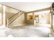 View of living room and kitchen with staircase, highlighting open floor plan at 7131 Topp Creek Ct, Indianapolis, IN 46214