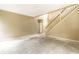 Spacious living room with staircase, showcasing potential for customization at 7131 Topp Creek Ct, Indianapolis, IN 46214
