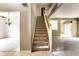 Carpeted staircase leading to the second floor, with views of the adjoining rooms at 7131 Topp Creek Ct, Indianapolis, IN 46214