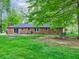 A spacious brick home with a brick patio and a large backyard at 7180 W Sacramento Dr, Greenfield, IN 46140