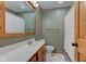 Well-lit bathroom features a white vanity, tile flooring, and wood accents at 7180 W Sacramento Dr, Greenfield, IN 46140