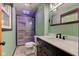 Updated bathroom featuring a glass enclosed shower, modern vanity, and stylish fixtures at 7180 W Sacramento Dr, Greenfield, IN 46140
