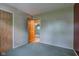 A carpeted bedroom features an open doorway with neutral paint and natural light at 7180 W Sacramento Dr, Greenfield, IN 46140