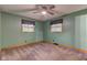 Carpeted bedroom featuring two windows that provide natural light and ventilation at 7180 W Sacramento Dr, Greenfield, IN 46140
