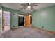 Bedroom featuring updated carpet, closet, and access to an ensuite bathroom with tiled shower at 7180 W Sacramento Dr, Greenfield, IN 46140