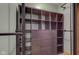 Walk-in closet with custom shelving and storage drawers provides ample space at 7180 W Sacramento Dr, Greenfield, IN 46140