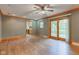 Open living room showcases hardwood floors, and a view of the kitchen and backyard at 7180 W Sacramento Dr, Greenfield, IN 46140