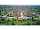 Aerial view of a well-established neighborhood, featuring tree-lined streets and a variety of home styles at 7634 Pennycroft Dr, Indianapolis, IN 46236