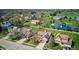 Gorgeous aerial view of the neighborhood with lush green lawns, mature trees and a beautiful pond with a fountain at 7634 Pennycroft Dr, Indianapolis, IN 46236