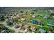 Beautiful aerial view of a neighborhood with green lawns and a pond near a golf course on a sunny day at 7634 Pennycroft Dr, Indianapolis, IN 46236