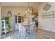 Bright dining area featuring stylish decor and seamless flow to the kitchen at 7634 Pennycroft Dr, Indianapolis, IN 46236