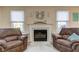 Cozy fireplace area in the living room, perfect for relaxation and gatherings at 7634 Pennycroft Dr, Indianapolis, IN 46236