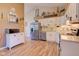 Spacious kitchen with stainless steel refrigerator and white cabinets, ideal for cooking and entertaining at 7634 Pennycroft Dr, Indianapolis, IN 46236