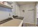 Functional laundry room with modern washer and dryer, enhanced by a light gray color scheme at 7634 Pennycroft Dr, Indianapolis, IN 46236