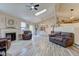 Spacious living room boasts a fireplace, vaulted ceilings, and seamless flow to the dining area at 7634 Pennycroft Dr, Indianapolis, IN 46236