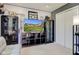 Bright living room boasts large tv on entertainment center, cabinets and a white closet at 7634 Pennycroft Dr, Indianapolis, IN 46236