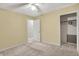 Bedroom showcasing a walk-in closet and natural light through the doorway at 7702 Dornock Dr, Indianapolis, IN 46237