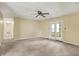 Bright living room with french doors leading to the backyard at 7702 Dornock Dr, Indianapolis, IN 46237