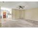 Inviting living room with fireplace and open layout to the kitchen and hallway at 7702 Dornock Dr, Indianapolis, IN 46237