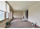 Inviting sunroom featuring carpet flooring and bright neutral colored walls and plenty of natural light at 7702 Dornock Dr, Indianapolis, IN 46237