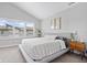 Serene bedroom featuring a comfortable bed, neutral colors, plantation shutters, and stylish bedside tables at 8180 E 116Th St, Fishers, IN 46038
