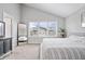 Comfortable bedroom features plantation shutters, vaulted ceilings, a neutral palette, and a minimalist design at 8180 E 116Th St, Fishers, IN 46038
