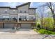 Modern townhome with grey exterior, balconies, and a two-car garage at 8180 E 116Th St, Fishers, IN 46038