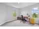 Bright office space with a modern desk, rolling chair, large window, and natural light, perfect for work or study at 8180 E 116Th St, Fishers, IN 46038