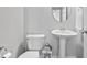 Stylish powder room with pedestal sink, decorative accents, and modern fixtures at 8180 E 116Th St, Fishers, IN 46038