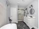 Elegant bathroom features a double vanity, glass-enclosed shower, and a soaking tub at 838 N Tacoma Ave, Indianapolis, IN 46201