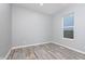 Bright bedroom with a large window and neutral decor, offering a versatile space at 838 N Tacoma Ave, Indianapolis, IN 46201
