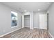 Bedroom boasts recessed lighting, neutral paint, wood-look floors, window, and walk-in closet at 838 N Tacoma Ave, Indianapolis, IN 46201