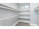 Spacious walk-in closet with ample shelving for storage and organization at 838 N Tacoma Ave, Indianapolis, IN 46201