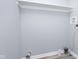 Walk-in closet with wood-look floors, gray walls, and overhead shelf at 838 N Tacoma Ave, Indianapolis, IN 46201