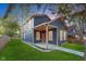 Charming two-story home with a manicured lawn and inviting front porch at 838 N Tacoma Ave, Indianapolis, IN 46201