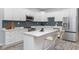 Modern kitchen featuring white cabinets, stainless appliances, and a center island with seating at 838 N Tacoma Ave, Indianapolis, IN 46201
