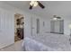 Spacious bedroom with adjoining bathroom featuring a vessel sink vanity and closet with built-in storage at 91 Crestview Dr, Greenwood, IN 46143