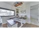 Cozy dining nook with wooden bench seating, stylish pendant lights, and ample natural light at 91 Crestview Dr, Greenwood, IN 46143