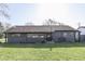 Charming single-story home with well-manicured lawn, gray siding, and ample natural light at 91 Crestview Dr, Greenwood, IN 46143