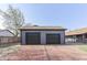 Two-car garage with a brick driveway and adjacent house at 91 Crestview Dr, Greenwood, IN 46143