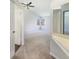 Spacious bedroom with vaulted ceiling, ceiling fan, and natural light from two large windows at 9162 Hadway Dr, Indianapolis, IN 46256