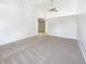 Expansive bedroom with vaulted ceilings and a fan, with an entrance to an adjacent bathroom at 9162 Hadway Dr, Indianapolis, IN 46256
