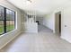 Tiled dining area with a view to the backyard, with natural light from large windows at 9162 Hadway Dr, Indianapolis, IN 46256