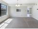 Bright dining room with neutral carpet, a chandelier, and natural light from large windows at 9162 Hadway Dr, Indianapolis, IN 46256