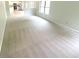 Spacious living room with neutral carpeting and ample natural light from the large window at 9162 Hadway Dr, Indianapolis, IN 46256