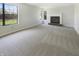 Bright and spacious living room featuring a fireplace, natural light, and neutral carpet at 9162 Hadway Dr, Indianapolis, IN 46256