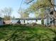 Backyard with a fire pit, shed, and a small deck at 10360 Wilson Rd, Brownsburg, IN 46112