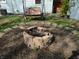 Backyard with brick fire pit and swing at 10360 Wilson Rd, Brownsburg, IN 46112